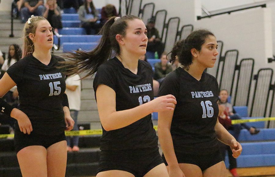 (left to right) Sophomores Nicole Smith and Grace Ramkissoon and senior Tessa Laney walking off the court. Laney will continue her volleyball career at Troy University, while Smith and Ramkissoon will come back for the Panthers next season.