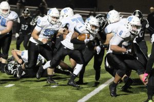 Senior Kalen Sims looks to break through Riverdale defenders for a big gain. Sims had another tremendous game on the ground, rushing for 150 yards and three touchdowns in the win.