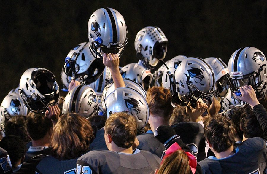 Panther football team raises their helmets in celebration after the win. Starr’s Mill used a dominant offense and a lockdown defense to defeat Fayette County 49-7 en route to winning their fourth-straight region championship.