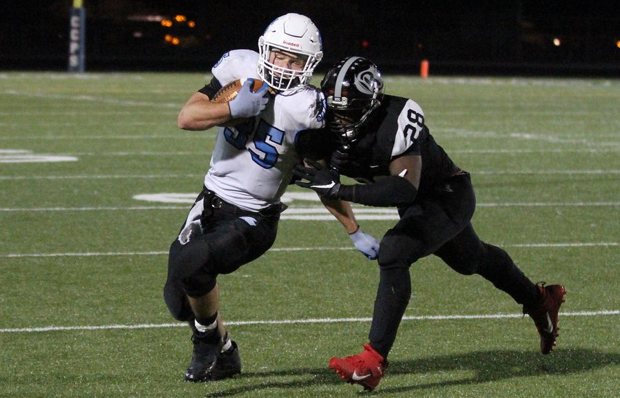 Senior Karsen Kalen looks to beat a Riverdale defender for a big gain. Riverdale has a big game this Friday against Griffin that will determine the number two seed and home-field advantage for the first round of state playoffs.