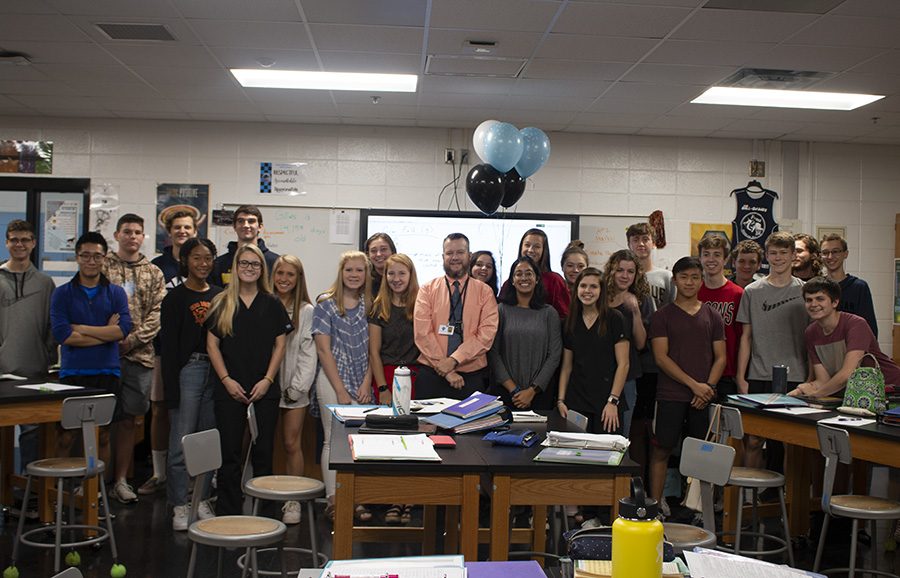 Nicholas Gillies (middle) has been announced as this year’s Teacher of the Year for Starr’s Mill High School. Gillies teaches physics and AP physics.