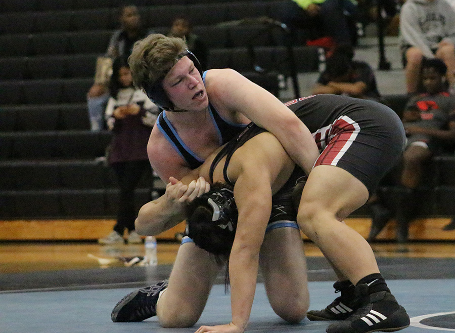 Senior Bret Myers wraps his arms around a Whitewater opponent. Myers went 3-0, winning all matches by pin. The Starr’s Mill wrestling team went 2-1 in their duals to qualify for state. “We have a lot of guys that don’t have a lot of experience and I think that inexperience showed in the matches,” head coach Andrew Garner said. “Although it’s tough this year, with the inexperience, it helps in the long run.”