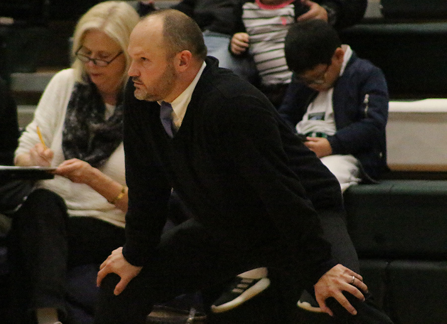 Head coach Josh Reeves observes the action on the court. Reeves has proven to be a dedicated head coach in his first season, despite the team’s disappointing record. “I’ve never questioned our effort,” Reeves said. “I’ve seen our team get better. When you get 75 percent of the way you want to see what it looks like 100 percent of the way, and I want to see it with these kids.”
