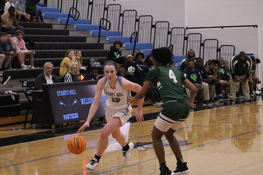 Senior Alice Anne Hudson drives down the lane against a Ram defender. Hudson posted 27 points in her final game as a Lady Panther. In her career, Hudson broke the single game scoring record, and surpassed 1,500 career points to become the all-time leading scorer in both girls’ and boy’s basketball.