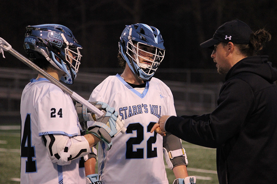 Juniors Luke Rusterucci and Gabe Lopez talking wish assistant coach Alex Haskins (left to right). Starr’s Mill boys’ lacrosse has kicked off their season with tremendous success. Through their opponents they have found a lot of opportunities to improve and prepare for greater competition.