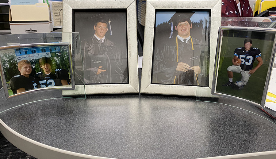 Photos of Panther alumni Bryce and Kyle Petty displayed on guidance counselor Colleen Petty’s desk. Colleens sons both played football during their time at the Mill. 