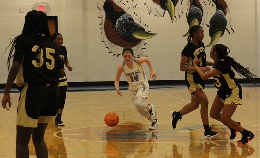 Senior Ashtyn Lally comes down the court during the Lady Panthers’ region semifinal matchup against the Fayette County Lady Tigers. Lally scored 12 points, all of which were three pointers. Starr’s Mill recovered from a sluggish first half to win the game 50-28 and secure a spot in the region championship. Lally recently committed to Huntington College.