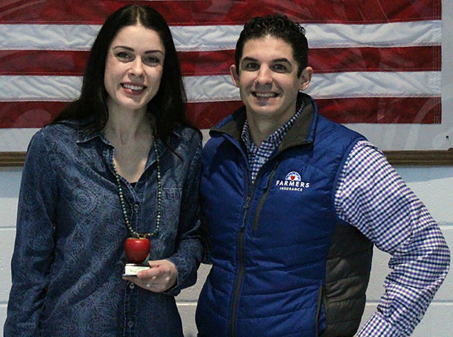 German and dance teacher Antonlea Brkic stands with Tim Monihan of Farmers Insurance. Farmers Insurance sponsors Golden Apple and awards each winner with $100 to use to benefit their classroom.