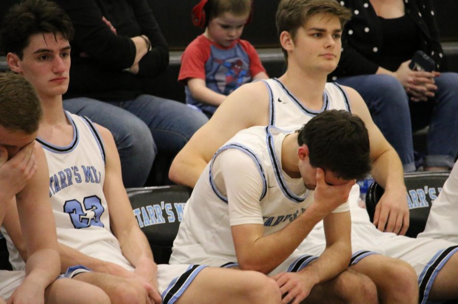 Senior Zac Cerniglia in tears on the bench in the final minutes of the first round region tournament match against the Jonesboro Cardinals. Cerniglia scored two points in his final game. The Panthers lost control in the third quarter to lose to Jonesboro by a final score of 60-42. The 2019-2020 boys’ basketball team becomes the first team in Starr’s Mill history to lose all region games in their schedule.
