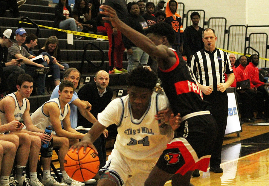 Sophomore Malachi Townsend drives in the paint for a layup. Townsend led the Panthers in scoring with 13 points. Townsend was benched due to foul trouble near the end of the first quarter after scoring eight points straight points to begin the game.