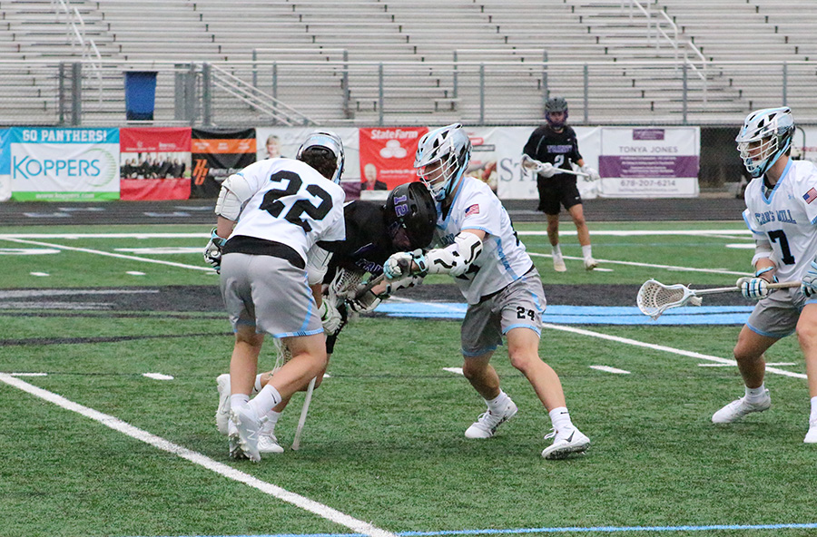 Juniors Gabe Lopez and Luke Rusterucci press into a Trinity player. The boys’ lacrosse team has shown a new level of aggressiveness that has worked wonders for their success. “We just try to pressure the ball to create turnovers, and we try to do it the right way,” head coach Jeff Schmidlkofer said. “The guys are really buying into it, but there’s a right way and a wrong way to do it.”