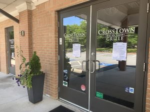 The front doors of Crosstown Grille with reopening notices placed on them. Small businesses like Crosstown Grille and Maguire’s Irish Pub have dealt with the sustained from the coronavirus pandemic. Owner Frank Maguire has battled through the financial chess game with what little money his business is earning to keep his business alive. The new reopening orders from Governor Brian Kemp may be a doorway for better days with the right responsibility taken.