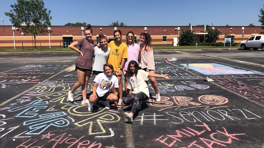 The class of 2021 gather to show off their freshly decorated parking spots. Although senior year will look different for the class, they are trying to make the most out of all of their opportunities. 