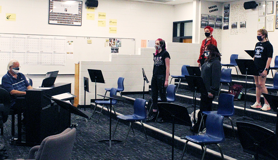 Choral director Dr. John Odom instructs Chanticleer from a distance. All students are separated in 6-foot intervals and required to wear masks. Studies have shown that it is safe to sing for 30 minutes without the spread of aerosol in the air. Many students have switched to virtual further reducing the risk of contact, but fewer students and strict guidelines have forced many changes and adaptations in the performing arts.