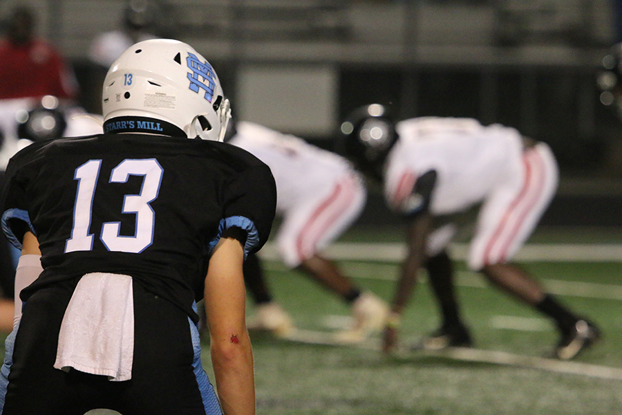 Senior cornerback Jonathan Higle prepares for an upcoming snap during their home game against the Mt. Zion Bulldogs last Friday. The Panthers steamrolled Mt. Zion 35-0 their first victory of the season. In this game, a new name rose to prominence in style, and the defense stayed strong against a crafty scrambler. Unlike most Starr’s Mill games, it was the opponent that was taking control of the game clock while the Panthers coasted with rapid-fire rushing touchdowns.