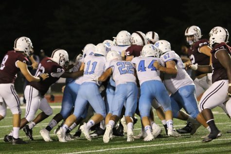 Panther defense surrounds the ball carrier during their matchup against the Union Grove Wolverines last Friday in McDonough, Georgia. Against some stiff competition, the Panthers outlasted Union Grove 19-14 in a suspenseful finale. In this game, we saw how the Panthers reacted to a similar style offense, the resolve from a sophomore quarterback, and a level of speed the Panther backfield may have for the first time in a while.