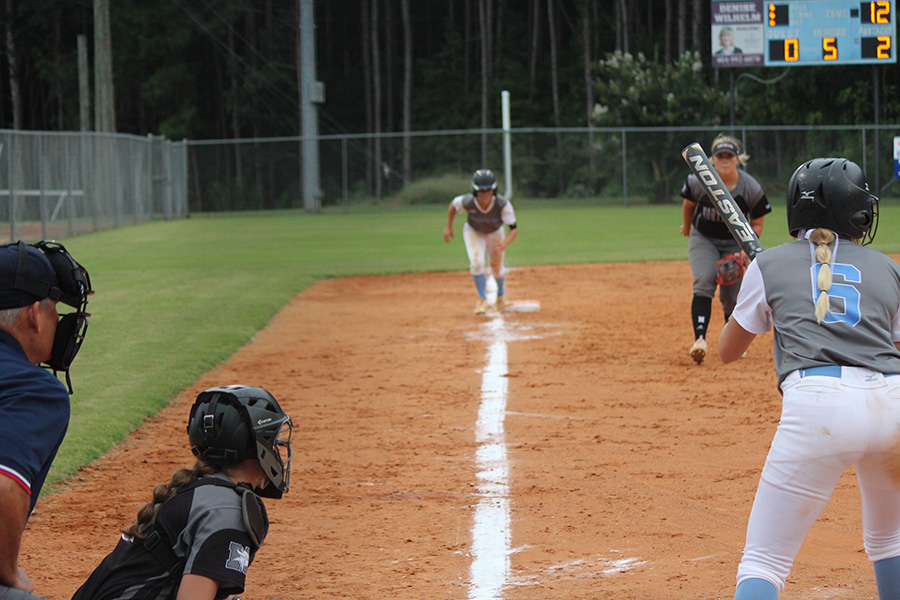 Senior Jolie Lester prepares for her at bat, while fellow senior Lauren Flanders looks to score from third. Strong hitting by Lester and 16 strikeouts from junior pitcher Lilli Backes helped the Lady Panthers even their region record at 4-4. The 3-0 win over Northgate moved Starr’s Mill into fourth place in Region 2-AAAAA.