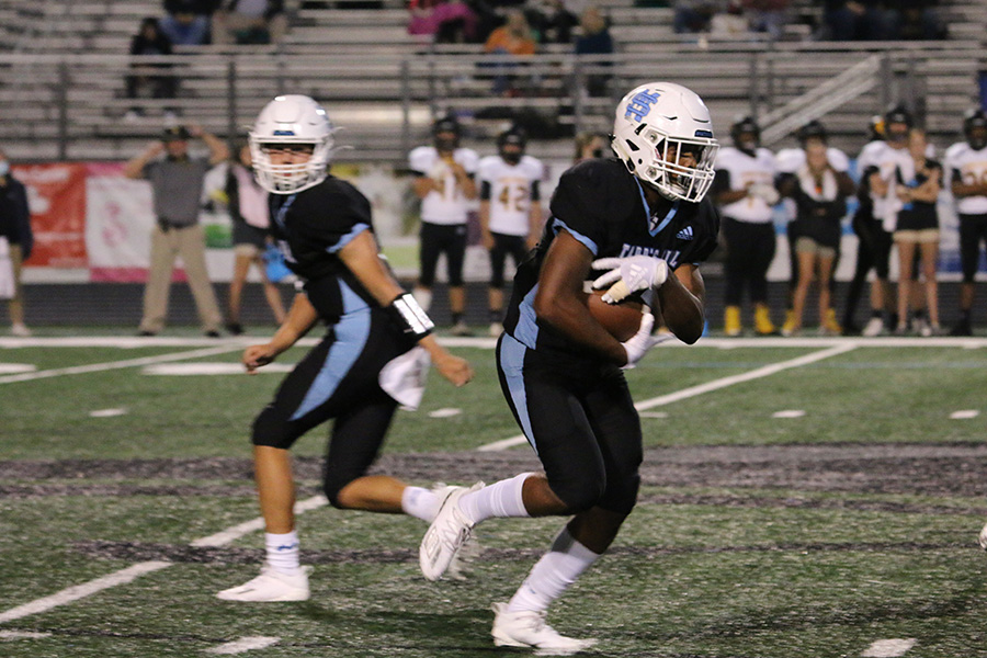 Junior running back Brandon Mathis takes a handoff during the Panthers’ first region game against Harris County where Starr’s Mill won 14-10. Whether it be a new breakout back, a threat on the other side, or the team culture on display, there was a lot to take away from that game. Mathis led the team in rushing with 16 carries for 94 yards.