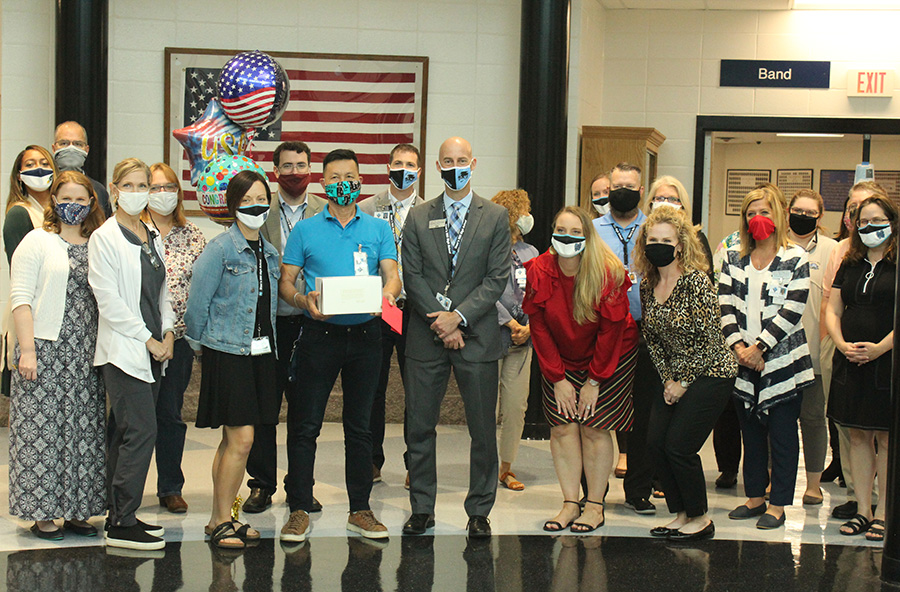 School custodian Hai Le pictured with fellow Starr’s Mill staff as they celebrate his citizenship. Originally from Vietnam, Le officially became a United States citizen for the sake of his family. 