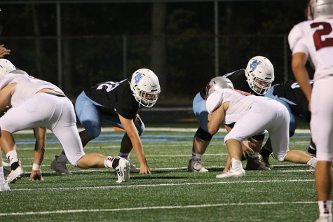 Senior offensive lineman Vee Holcomb awaits a snap during the Panthers’ final region home game against the Whitewater Wildcats this past Friday. On top of the Panther defense pulling off their third consecutive shutout, the Panther offense had one of their best games yet to pull out a convincing 42-0 win against a county rival. “We knew we needed to win this game to be sitting good in the region,” Holcomb said. “So we all knew as seniors [that] tonight was our last regular season home game, so it meant something to us.”