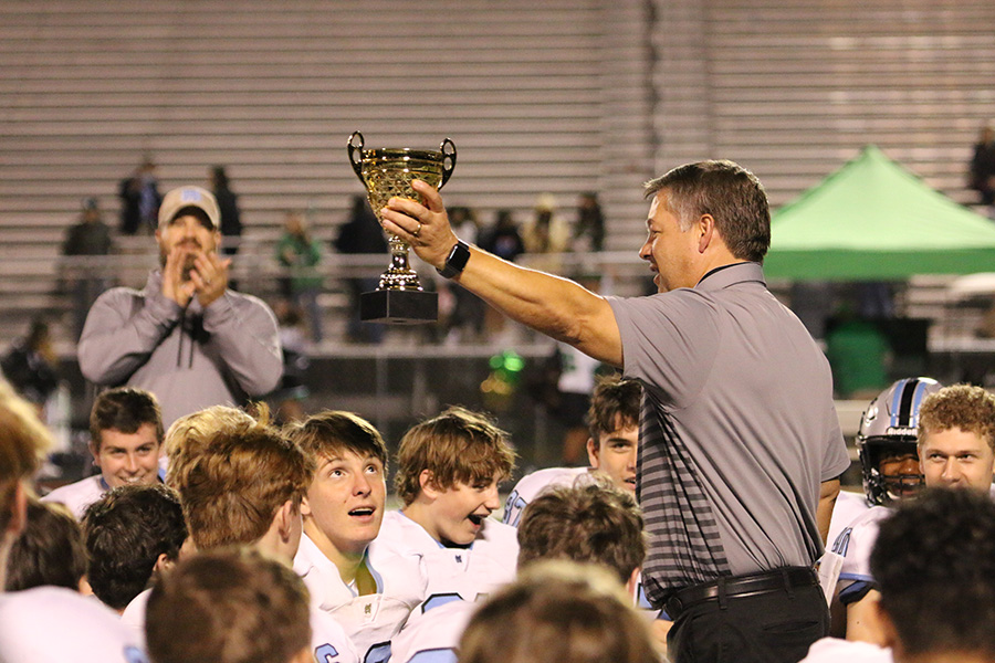 Head coach Chad Phillips hoists the region 2-AAAAA trophy in front of the football team after their victory against the McIntosh Chiefs last Friday. The Panthers took care of business to demolish the Chiefs 38-7. With this win, Starr’s Mill clinched its fifth region championship in a row. This is also their ninth region championship in program history, breaking the county record previously owned by Sandy Creek with eight.