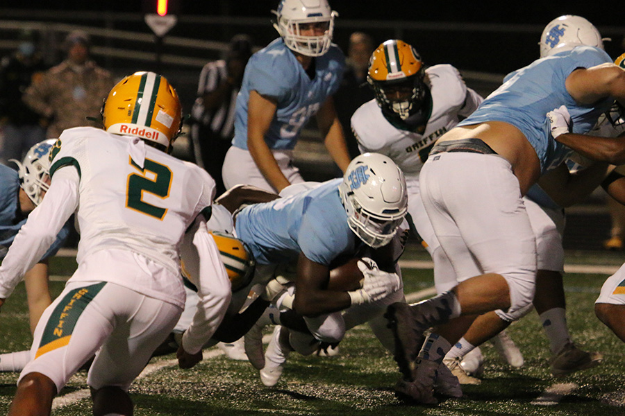 Sophomore running back Greigh Joseph dives forward during the Panthers’ home region game against the Griffin Bears this past week. The entire team came together to pull off a solid 21-0 shutout to widen the gap within the region. Even though the Panther offense only accumulated a total of 217 yards, they scored 21 points for just the second time this season. Whether it be the value of maturity, an explosive defensive line, or the progression of the learning curve, here are three takeaways from this past week’s game.