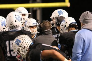 Head coach Chad Phillips talks with the offense during a timeout in the Panthers’ second round playoff game against the Coffee Trojans. Starr’s Mill ran with the Trojans for a while, but progressively lost control as the game went on, resulting in a 24-9 loss to eliminate Starr’s Mill from the playoffs. Against Coffee, Starr’s Mill set a season low for points scored and a season high for points allowed.