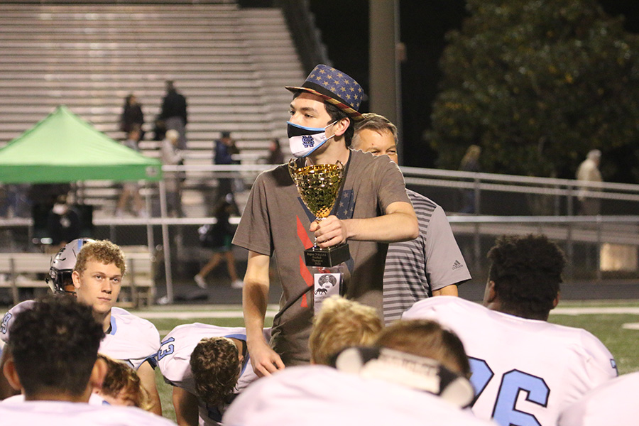 I present the Region 2-AAAAA championship trophy to the Starr’s Mill football team after their 38-7 victory over the McIntosh Chiefs last season. Since I really started getting into sports, I have grown to love several aspects of them. Covering Panther football’s 2018 quarterfinal game against the Dutchtown Bulldogs signifies my favorite sports moment and symbolizes why sports matter.