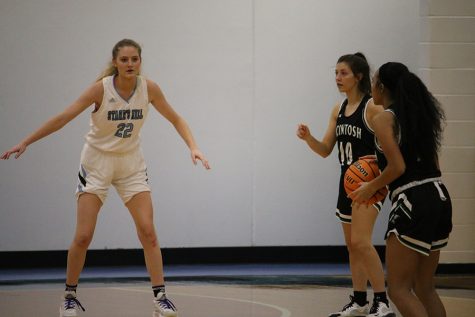 Junior Jacklyn Hester guards the basket. On Jan. 16, Hester scored 20 points against McIntosh, which included hitting her 1,000th point. She’s the fifth player and the third girl to achieve the accomplishment in Starr’s Mill history.