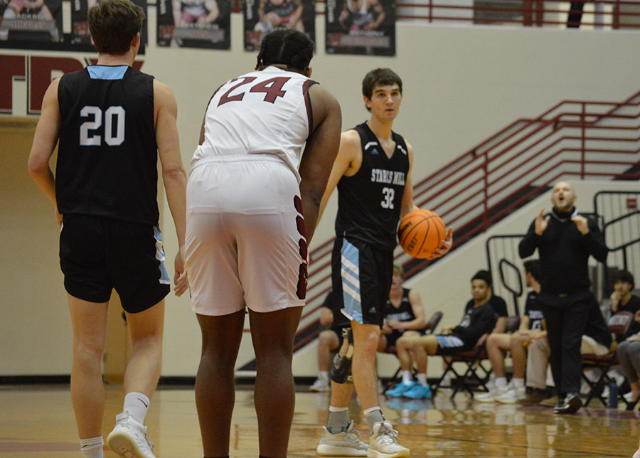 Senior+Brandon+Allison+controls+the+offense+while+Whitewater%E2%80%99s+senior+Miles+Lowe+guards+senior+Gabe+Sands.+Allison+tied+the+boys+team+record+with+seven+three-pointers+made+in+one+night.+He+now+shares+the+record+with+fellow+senior+Elliott+Baker.+Starting+off+the+game+with+Allison%E2%80%99s+three-pointer+in+the+first+ten+seconds%2C+aggressive+play+and+solid+execution+kept+Whitewater+out+of+contention+the+entire+night.+