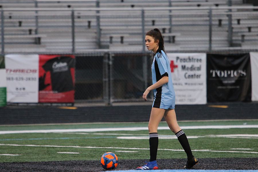 Freshman forward Mia Hargrove sets up for a free kick during the Lady Panthers’ home match against the St. Pius X Lady Golden Lions this past Tuesday. Due to an incomplete roster and inexperienced players on the field, the girls could not handle St. Pius and suffered a 4-0 defeat. Starr’s Mill had trouble getting past midfield all game long, only putting up one shot on goal. In contrast, St. Pius racked up 24 shots on goal on top of keeping the game in Panther territory.