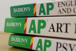 In previous years, students would complete an application and a work sample in order to be considered for Advanced Placement courses. However, AP courses across the county are now open enrollment, but they still require a minimum grade.
