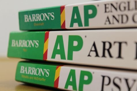 In previous years, students would complete an application and a work sample in order to be considered for Advanced Placement courses. However, AP courses across the county are now open enrollment, but they still require a minimum grade.