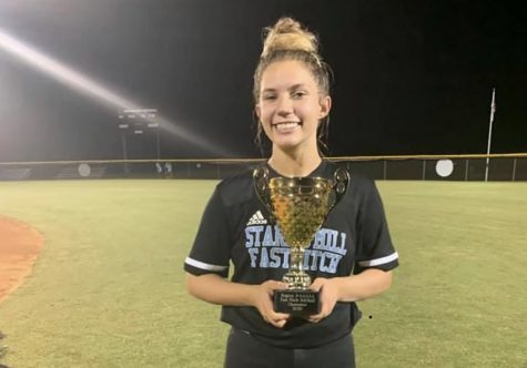 Junior Ashley Sikes poses with the 2020 Region 2-AAAAA championship trophy. While being known for her long-running softball passion, her heart lies with giving back to a more healthful community.