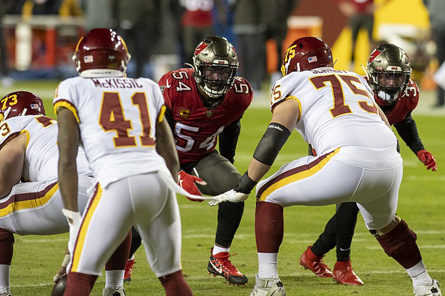 Tampa Bay Buccaneers linebacker Lavonte David waits for the upcoming snap during the team’s 31-23 wild card game win against the Washington Football Team at FedEx Field on Jan. 9. Last night, David and the Buccaneers successfully shut down the Kansas City Chiefs and their offense to win Super Bowl LV, 31-9. Kansas City did not score a single touchdown throughout the Super Bowl, the first time the team did not score a touchdown in a game since quarterback Patrick Mahomes took control under center. On top of six tackles, David helped contain Chiefs tight end Travis Kelce, limiting Kansas City’s most productive receiver to 10 receptions and 133 yards.