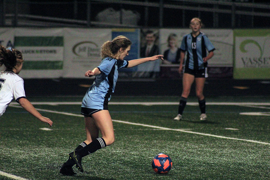 Senior midfielder Darby Olive moves the ball downfield during the girls varsity soccer game on Tuesday against the Marist. The Lady Panthers tied in a difficult game against Marist, 0-0.