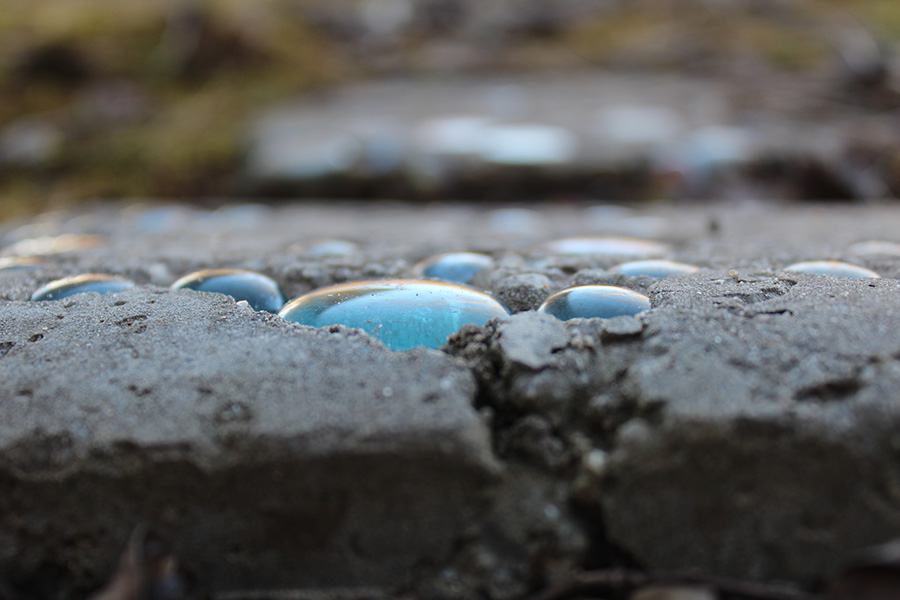 Jan. 15, 2021 - Cerulean marbles cemented in stone slab in the courtyard between the 600 and 700 hallways.