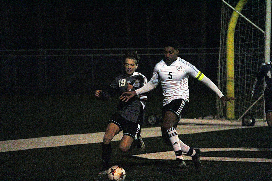 Senior captain Austin Morris fights McIntosh sophomore Caleb Kreitner for the ball during the Panthers’ rivalry game against the Chiefs last Thursday. Both boys and girls teams played the Chiefs in the tenth annual ‘Battle of the Bubble’ games where the girls fell 4-2, and the boys triumphed in penalty kicks. The boys game remained scoreless all the way through, with senior goalie Andrew Cole racking up six saves. “Any game like this, such high stakes on the line, region championship against the cross-city rivals, everybody wants it so bad and I wanted really really bad,” Cole said. “I gave it everything I had tonight. Super proud of all the boys too.”