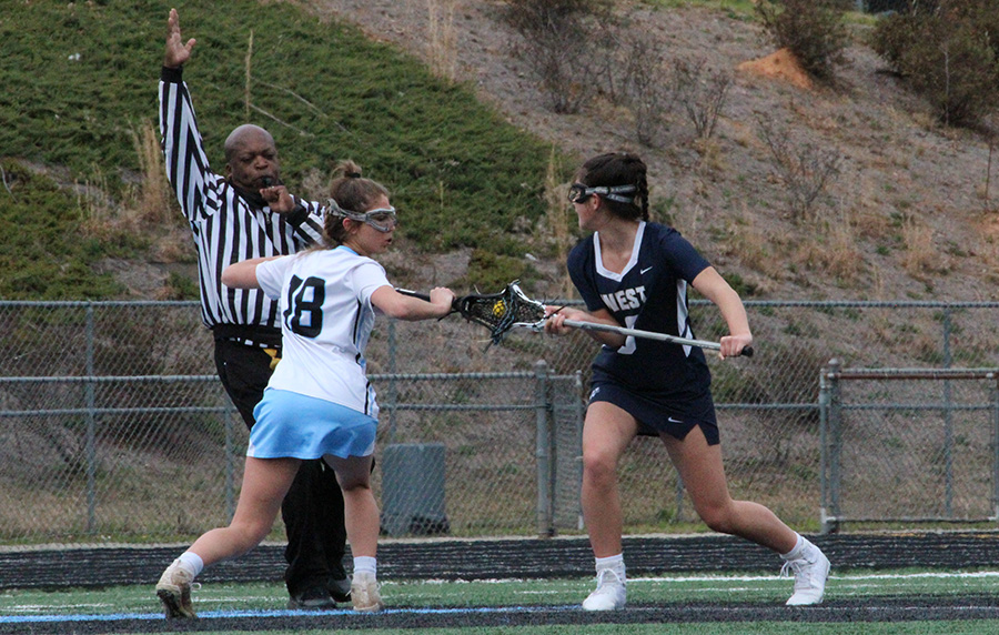 Senior Jess DeLuca covers a West Forsyth player during the Lady Panthers’ home opener against the West Forsyth Lady Wolverines this past Saturday. West Forsyth gave the Lady Panthers a snap back to reality in a 13-5 loss. West Forsyth had two girls record hat tricks. On the flipside, senior goalie Kaitlyn Donovan recorded 11 saves against West Forsyth.