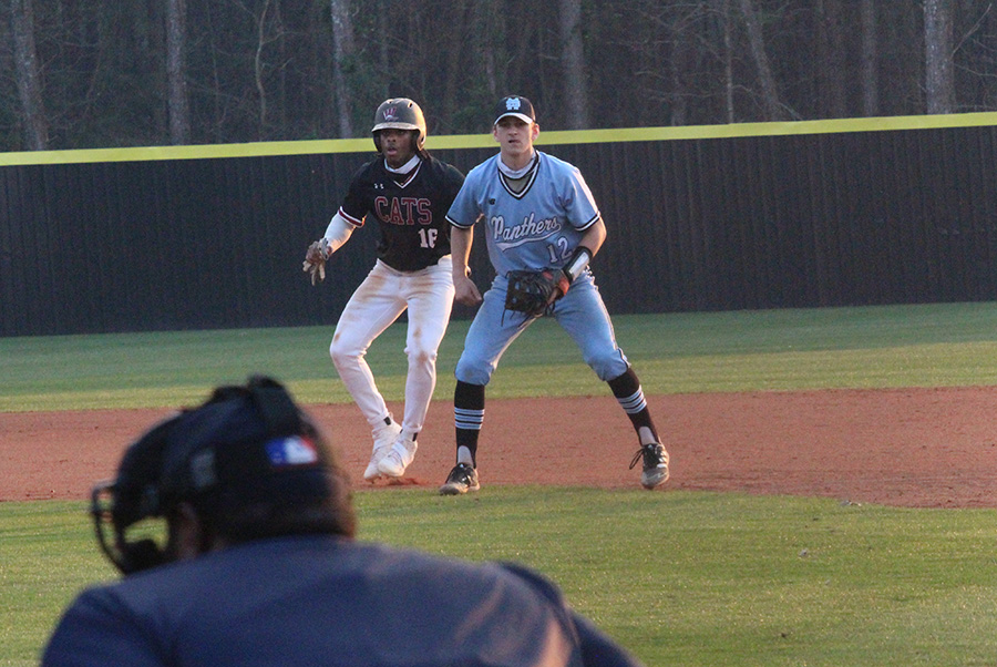 Junior first baseman Ben Moseley watches an upcoming pitching during the Panthers’ region game against the Whitewater Wildcats yesterday. Despite a sluggish first six innings, the team came together at the bottom of the seventh to propel themselves to a 7-6 win in extra innings. Moseley went 3-4 at the plate, including the game-winning RBI. “Feel’s great [to clinch that win],” Moseley said. “It’s our field, we’re defending it.”