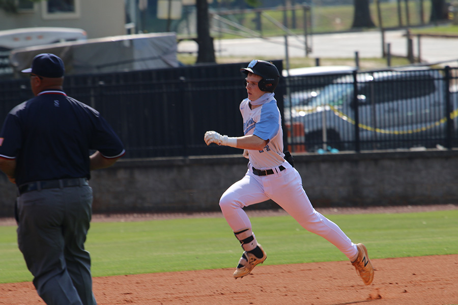 Freshman outfielder Heath Whitlock sprints toward first base during the Panthers’ first round playoff series against the Tri-Cities Bulldogs. Starr’s Mill had the Bulldogs’ number, swiftly defeating Tri-Cities by mercy rule in two games. The team scored 27 runs off of 20 hits. Whitlock went five-for-seven at the plate and batted in four runs.