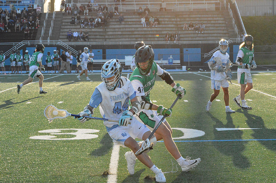 Starr’s Mill junior Michael Johnson dodges McIntosh senior Eric Habicht. Both teams were equally aggressive, but the Panthers defeated the Chiefs 6-3 and captured the area championship.