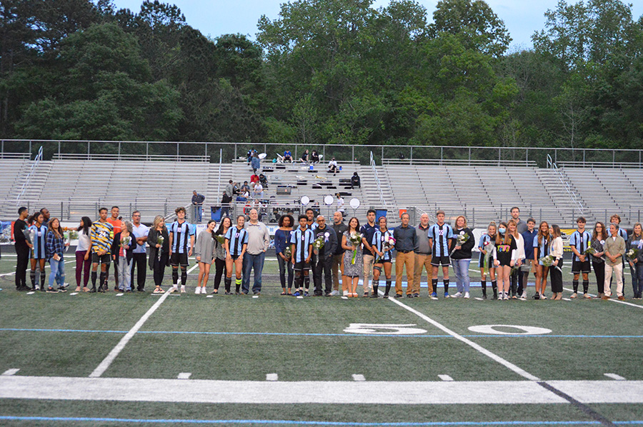 Seniors across both soccer teams pose for photos alongside their families between their games on senior night. Both teams honored their seniors for their contributions to Starr’s Mill soccer over their high school years. The girls team struggled against a quick and aggressive Harrison team and lost 3-0. On the flipside, the boys thrashed Hampton, mercying them 10-0.