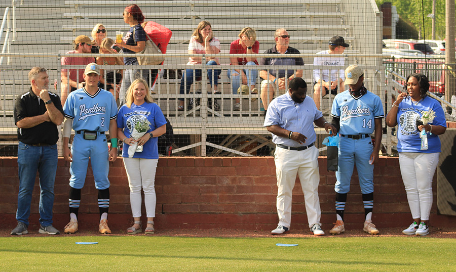 Seniors pitcher Eli Jones (left) and outfielder Thad Ector (right) stand alongside their families during the baseball team’s season walk prior to their Tuesday game against the Whitewater Wildcats. After 11 seniors were honored by the team, the Panthers went straight to work against Whitewater. Despite a messy fifth inning, Starr’s Mill played well and defeated the Wildcats 4-3. Both Jones and Ector will play baseball at the University of South Carolina next year.