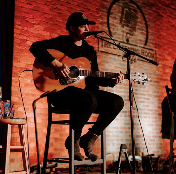 Rising artist Lily Rose performs at The Listening Room Cafe in Nashville, Tennessee, in early January. Her hit song "Villain," a mix of country and pop styles, highlights the aftermath of her breakup.