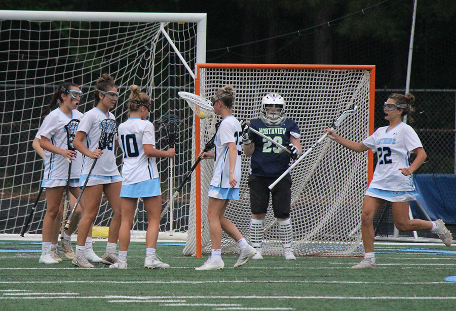 Senior midfielder Jacqueline Broderick celebrates with her team after scoring a goal against the Northview Titans last Tuesday. In the A-AAAAA semifinals, the Lady Panthers hosted Northview where the Panthers won 12-11 in a close contest to make it to the state championship for the third year in a row. Broderick racked up three goals, an assist, and three ground ball controls. She and senior midfielders Jessica DeLuca and Addie McDaniel all had hat tricks.