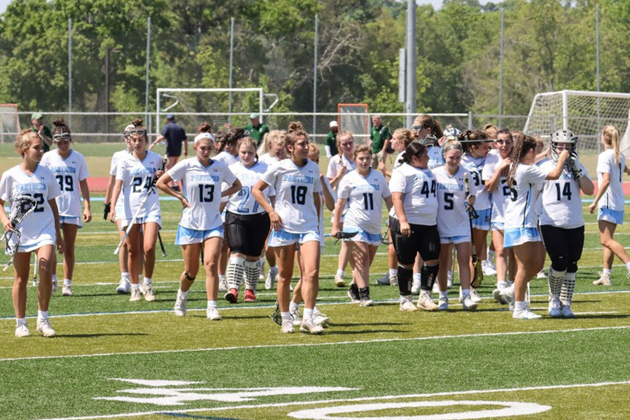 The+Lady+Panthers+lacrosse+team+walks+off+the+field+at+the+end+of+the+A-AAAAA+state+championship+game+against+the+Blessed+Trinity+Lady+Titans.+Though+they+put+up+a+fight%2C+Blessed+Trinity+was+too+much+of+a+dominant+force+to+overcome%2C+and+the+Lady+Panthers+fell+12-6.+This+was+the+first+time+in+the+season+since+early+March+that+the+team+was+not+able+to+overcome+a+deficit+they+fell+into.+Even+though+they+lost%2C+this+is+the+third+straight+year+the+Lady+Panthers+were%2C+at+worst%2C+the+state+runner-up.