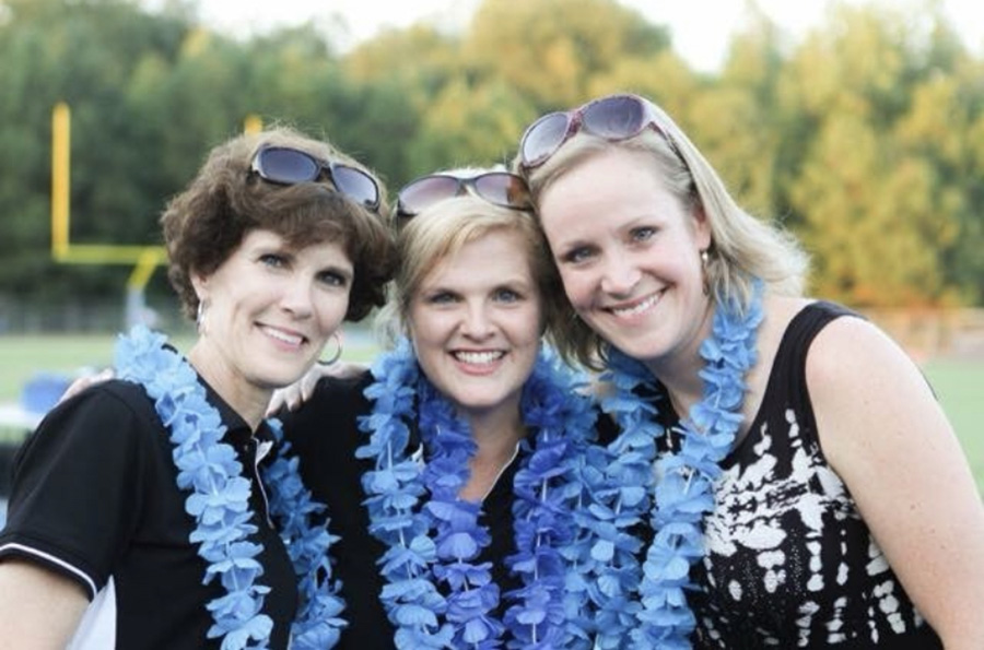 O’Shields working Senior Night with the graduation crew, math teacher Julie Spencer (left) and assistant principal Brandi Meeks (right).