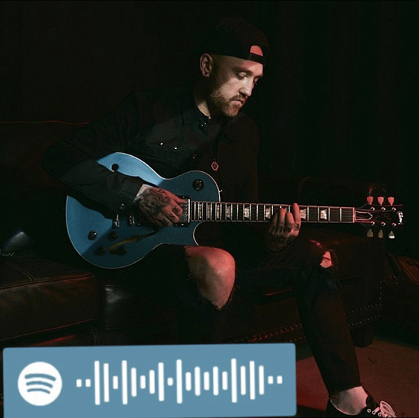 Forest Blakk poses with his guitar before a Facebook Live. If you haven’t checked out “If You Love Her” yet, nows the time.