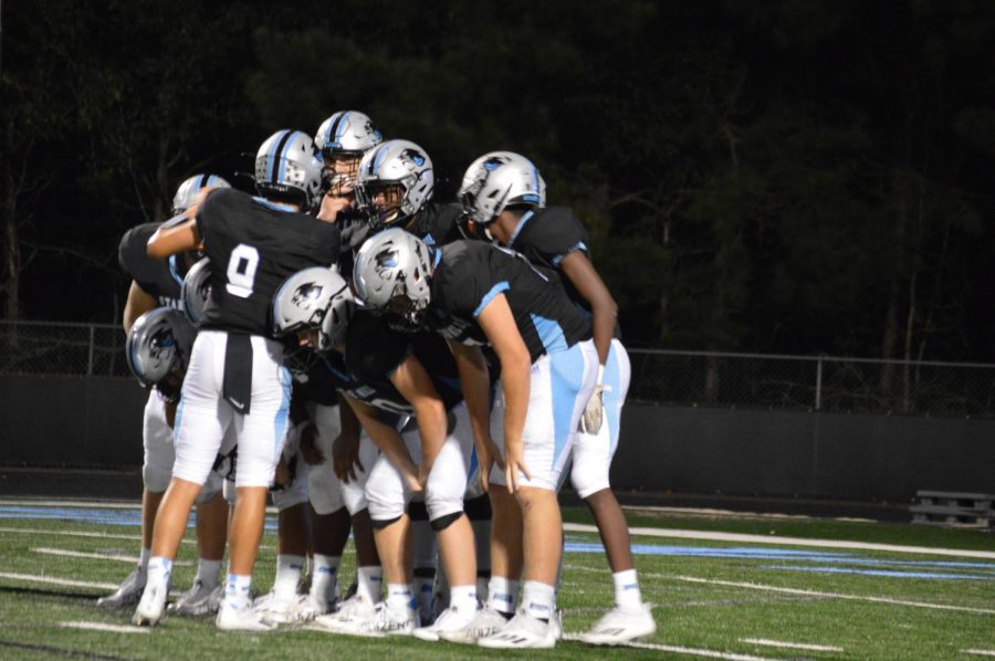 Junior William Yarbourgh in the huddle. “We’re just going to have a chip on our shoulder after a loss like this and coming into the next game I think we’re going to come out a lot rougher than we did and deliver the first punch instead of receiving it,” junior Josh Phifer said.